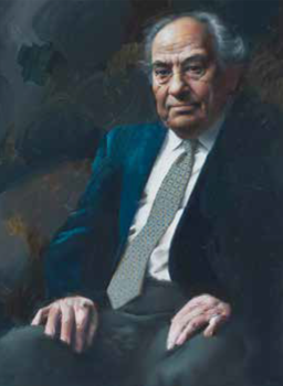 Elegáns férfi öltönyben Elegánsan öltözött férfi sötét öltönyben, fehér inggel és mintás nyakkendővel