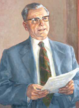 Elegáns férfi papírokkal Elegánsan öltözött férfi, aki papírokat tart a kezében.