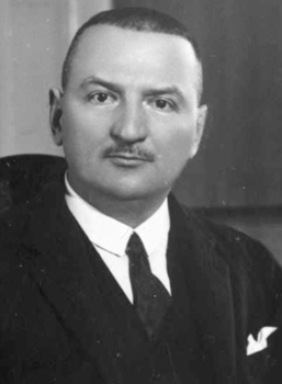 Elegáns öltönyben lévő férfi homályos arccal Elegáns öltönyben lévő férfi, fehér inggel és nyakkendővel, homályos arccal.