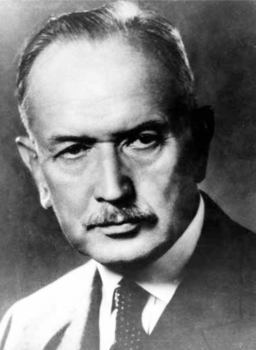 Fekete-fehér portré egy férfiról öltönyben Fekete-fehér portré egy férfiról, aki öltönyt és nyakkendőt visel