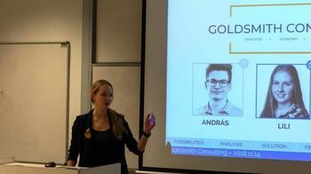 Goldsmith Consulting prezentáció 2018.11.14 Előadó prezentációt tart a Goldsmith Consulting logójával és két személy, András és Lili, fényképével.