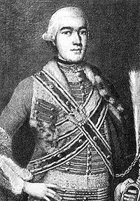 Történelmi katonai egyenruhát viselő személy Történelmi katonai egyenruhát viselő személy, díszes öltözékben.